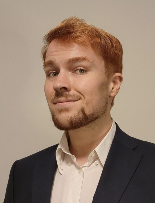 headshot of RJ Ryan Seutter